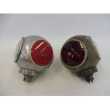 A pair of CAV divers helmet rear lamps.