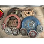 A collection of Alvis 14hp parts to include six hubcaps, two wheels, spare wheel covers, brake drums