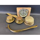 A North and Sons Watford car clock, plus three brass hub nuts, including one marked Worthy Steam