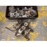 A collection of assorted carburettors, some believed to be Ford, VW, Morris etc.