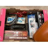 A box of assorted parts and tools including three foot pumps, an oiler, various headlamp rims etc.