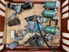 A tray of fuel pumps, oil filters, Stromberg carburettor etc.