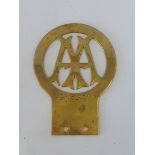 An AA Stenson Cooke type brass badge celebrating the lengthy run of the badge.