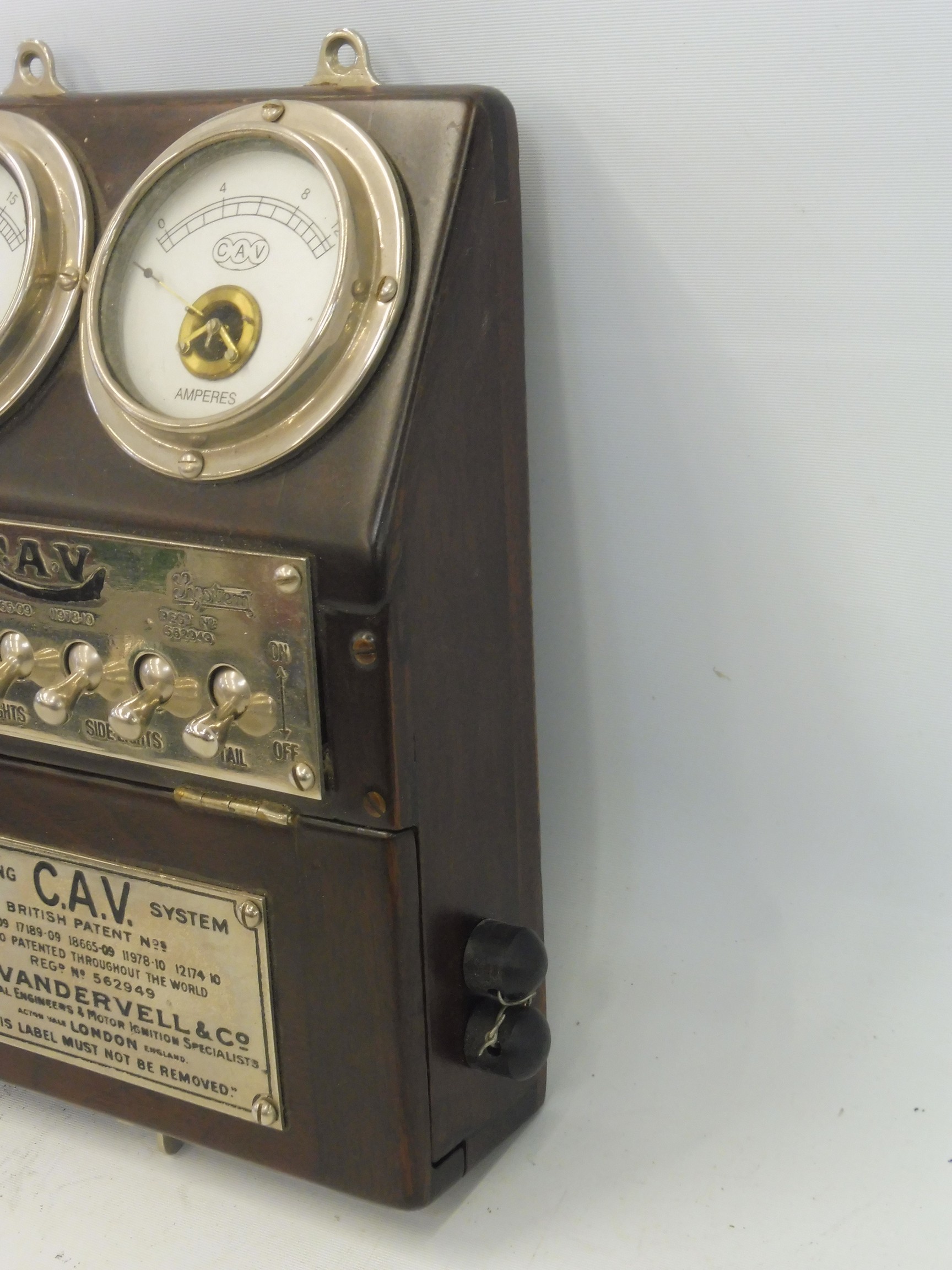 An Edwardian CAV bulkhead mounted switch panel, showing a voltmeter adjacent to an ammeter, above - Image 2 of 5