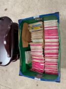 A box of OS maps and a modern model car cabinet.