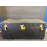 A Brooks trunk, with a shallow domed rising lid, and lift up inner lid, 32" w x 14" h x 18" d.