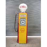 An Avery Hardoll 598 petrol pump restored in Shell livery with a plastic Shell globe.