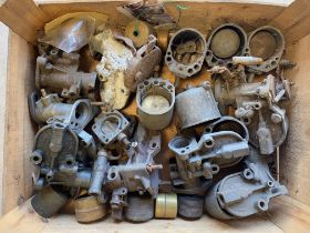 A tray of Austin 7 carburettors.