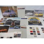 A selection of German sports car brochures including Bitter, Mercedes-Benz, Porsche etc.