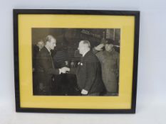 A framed and glazed black and white photograph of HRH The Duke of Edinburgh arriving at the AA AGM