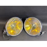 A good pair of Lucas PR100 chrome plated headlamps, in generally very good condition except for a