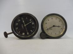 A North & Sons Watford black faced car clock and a silver faced Smiths eight day car clock.