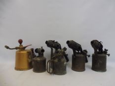 A quantity of brass blow lamps.