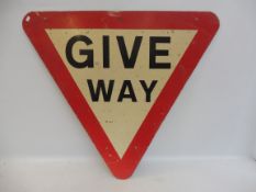 A Give Way triangular road sign, 30 1/2 x 27".