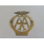 An unusually thin AA badge, possibly motorcycle, nickel, no. 718336.