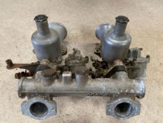 A pair of SU carburettors on a Mowag manifold.