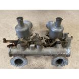 A pair of SU carburettors on a Mowag manifold.