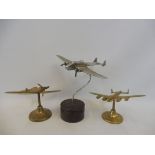 Three aeroplane desk stands including Spitfire etc.