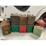 A Castrol five gallon can, one other, plus seven two gallon petrol cans including a Pratts