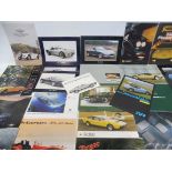 A quantity of British sports car brochures including AC, Aston Martin, Lotus, Marcos, Martin, MG,