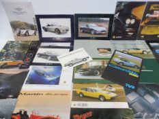 A quantity of British sports car brochures including AC, Aston Martin, Lotus, Marcos, Martin, MG,