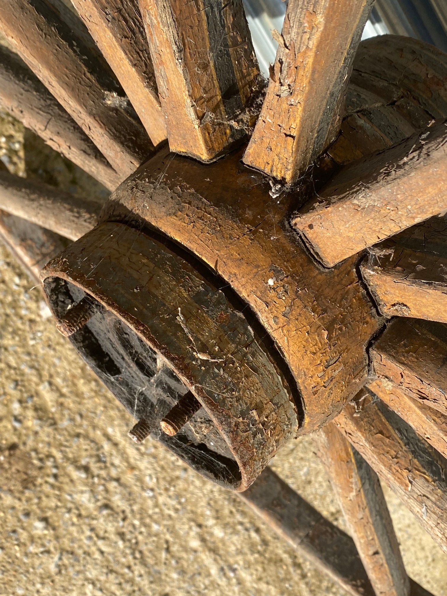 A large wooden and metal rimmed cart wheel with traces of original paint. - Image 4 of 4