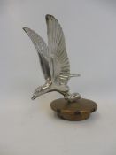 An Alvis eagle mascot on a loosely fitting radiator cap.