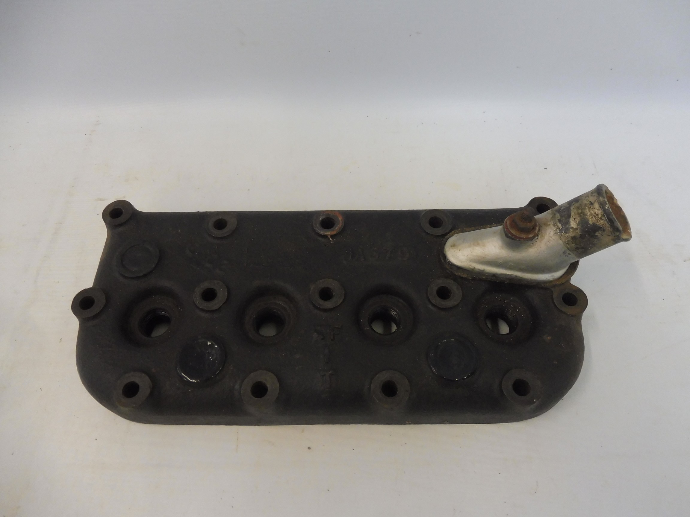 An Austin 7 cylinder head, marked 'AFIT', 'IA670' and '20 3 4' by repute a performance head.