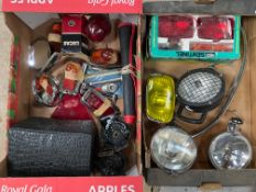 Two boxes of assorted lamps and lenses including spot lamps, a fog lamp, Wipac set of lights etc.