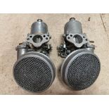 A pair of SU carburettors plus pancake filters.