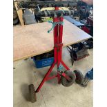 A folding Go Kart stand, jockey wheel needs repair.