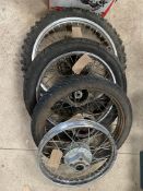 Four motorcycle wheels.