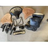 A collection of Indian motorcycle spares comprising three saddles, two being new tan