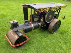 A scale model of a road roller traction engine, runs on an electric motor.