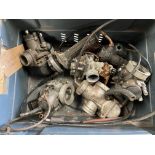 A box of motorbike carburettors.