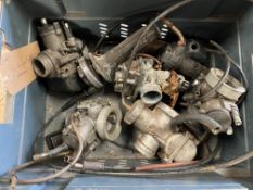 A box of motorbike carburettors.