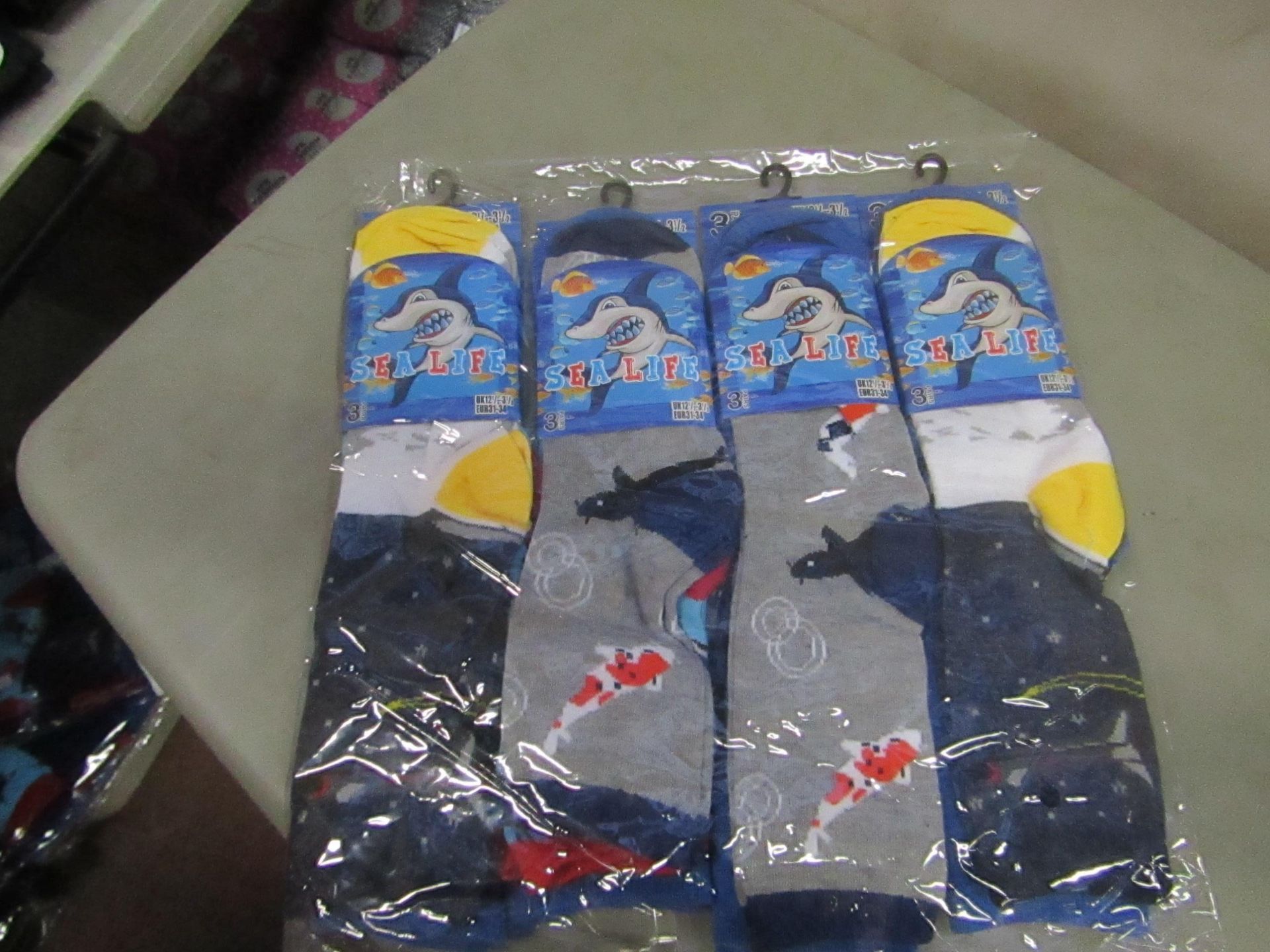 12 Pairs of Size 12.5 - 3.5 Sea Life Socks. New & packaged