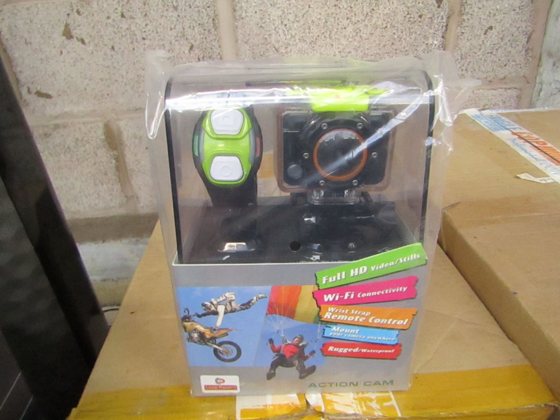 Full HD sports WiFi action camera with accessories and bracelet, tested working and boxed.