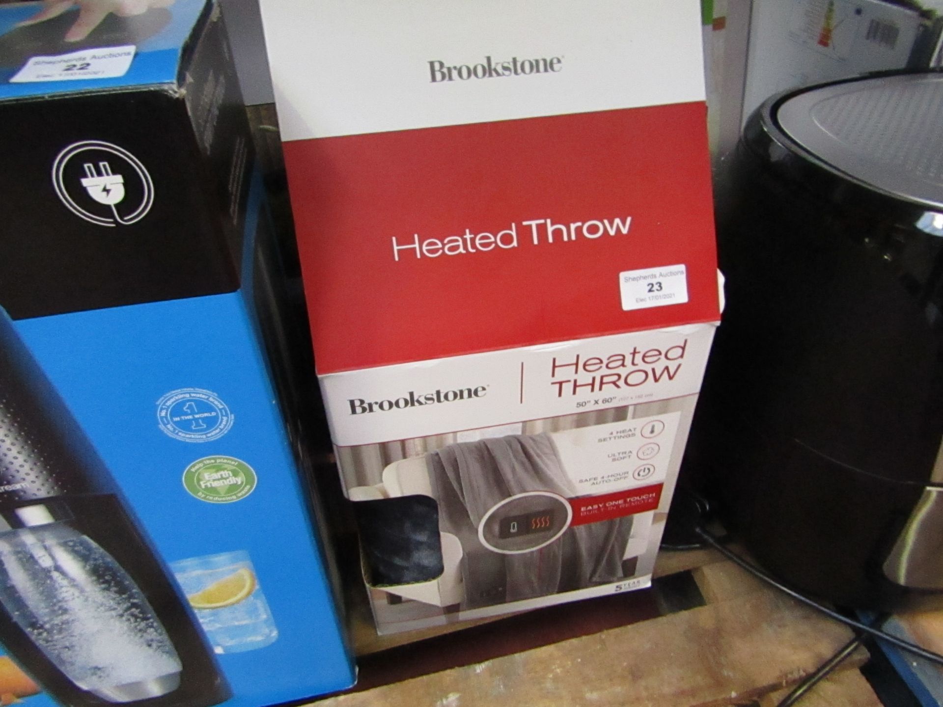 Brookstone heated throw 50 x 60", unchecked and boxed.