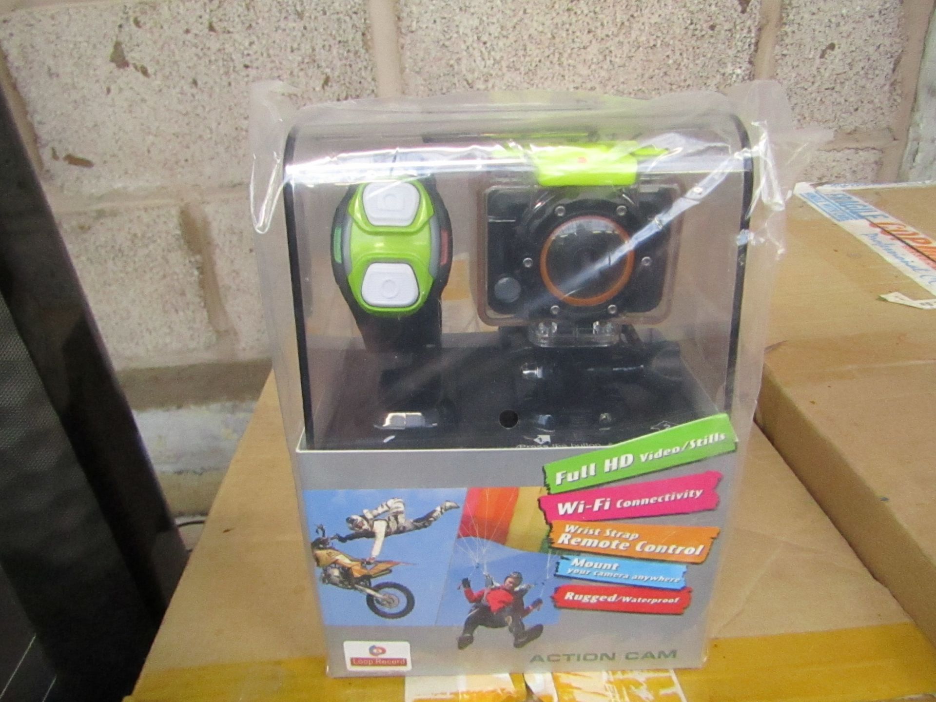 Full HD sports WiFi action camera with accessories and bracelet, tested working and boxed.