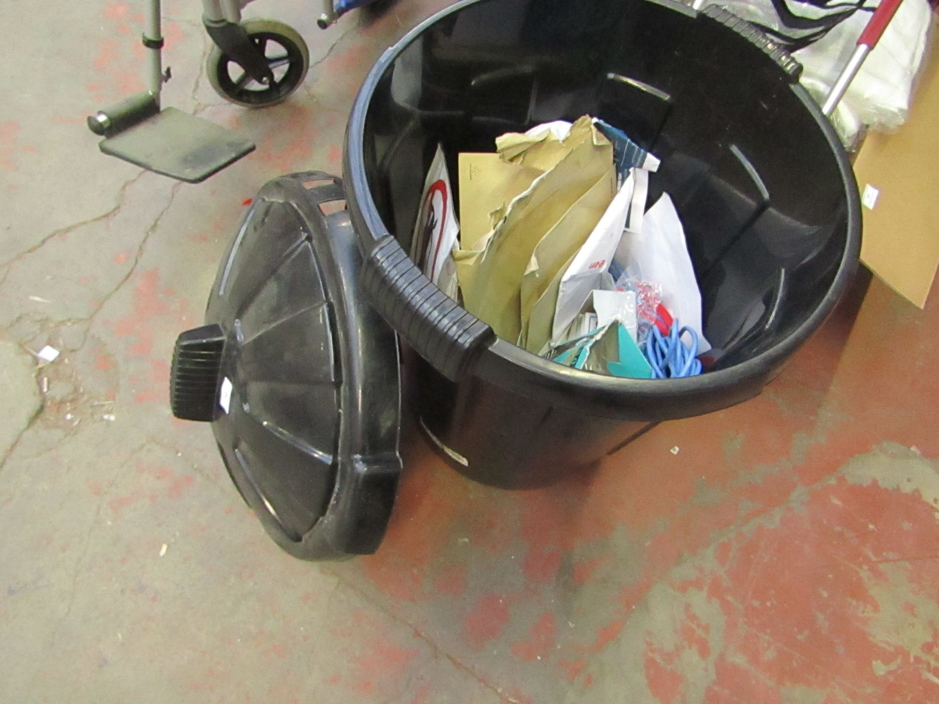 Black plastic bin and contents which include Elastic bands, ethernet cable and more