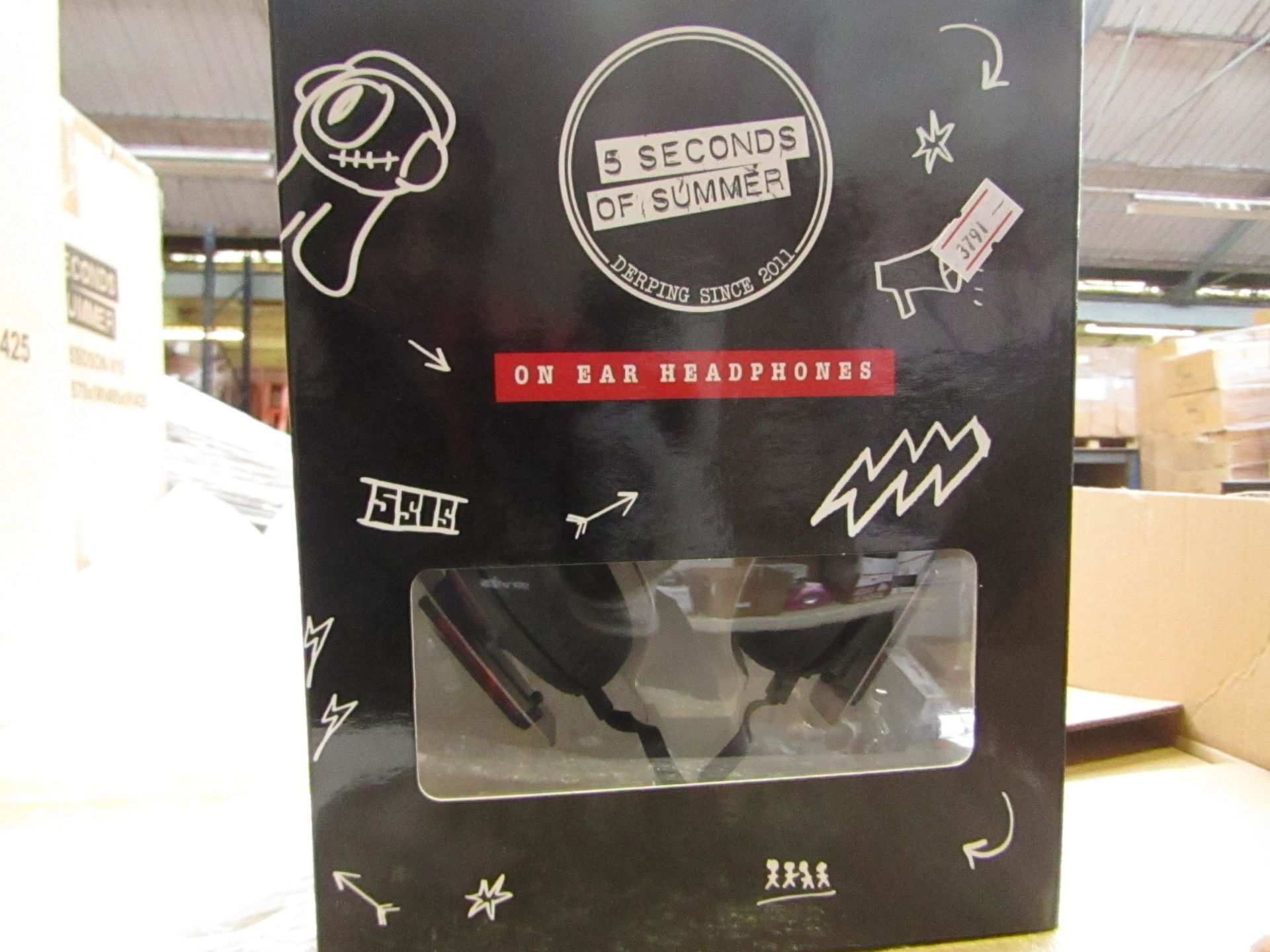 5 Seconds of Summer headphones , new and boxed.