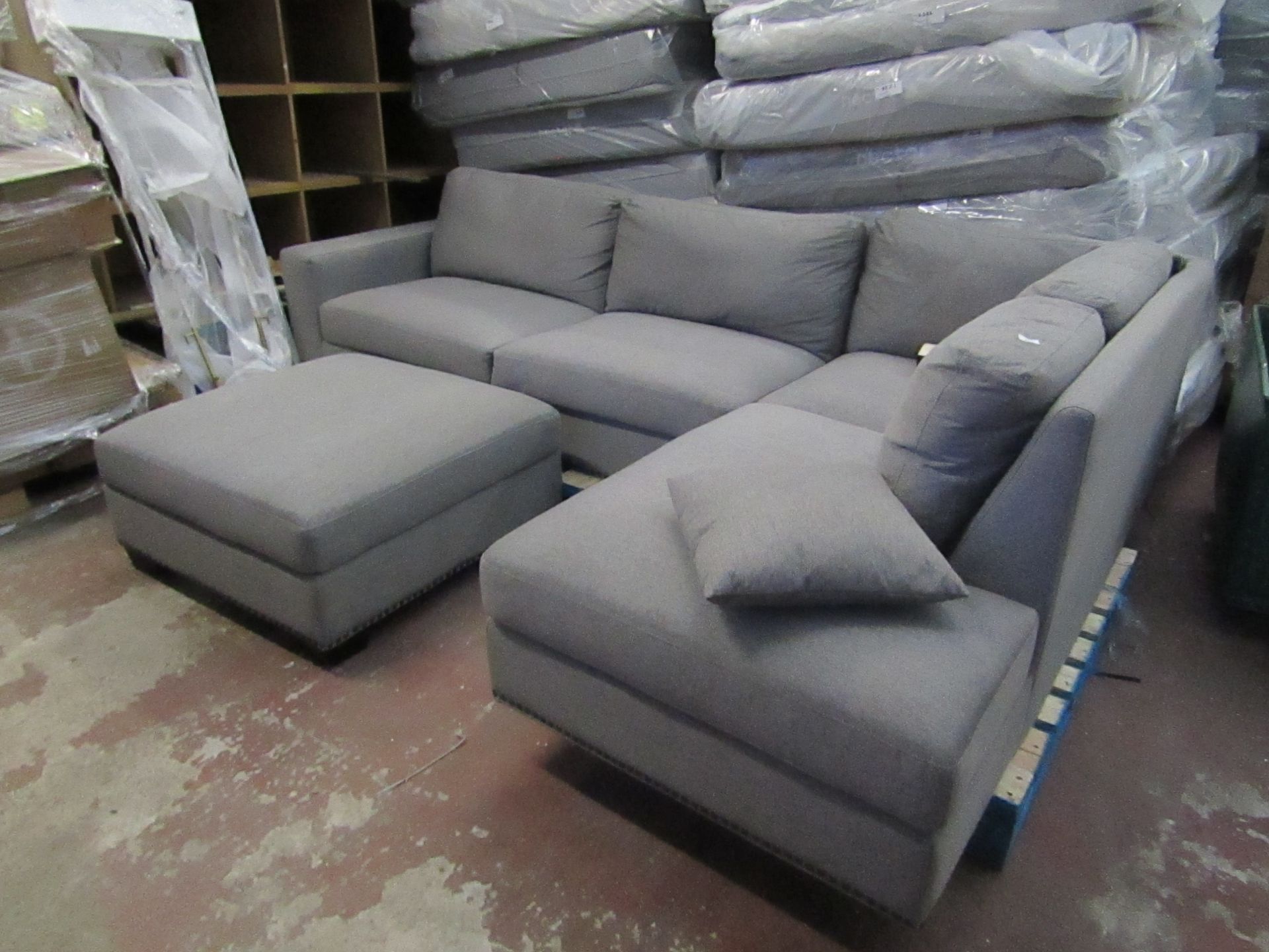 Costco Grey 3 piece corner sofa, complete with feet, looks in good condtion just a coupole of