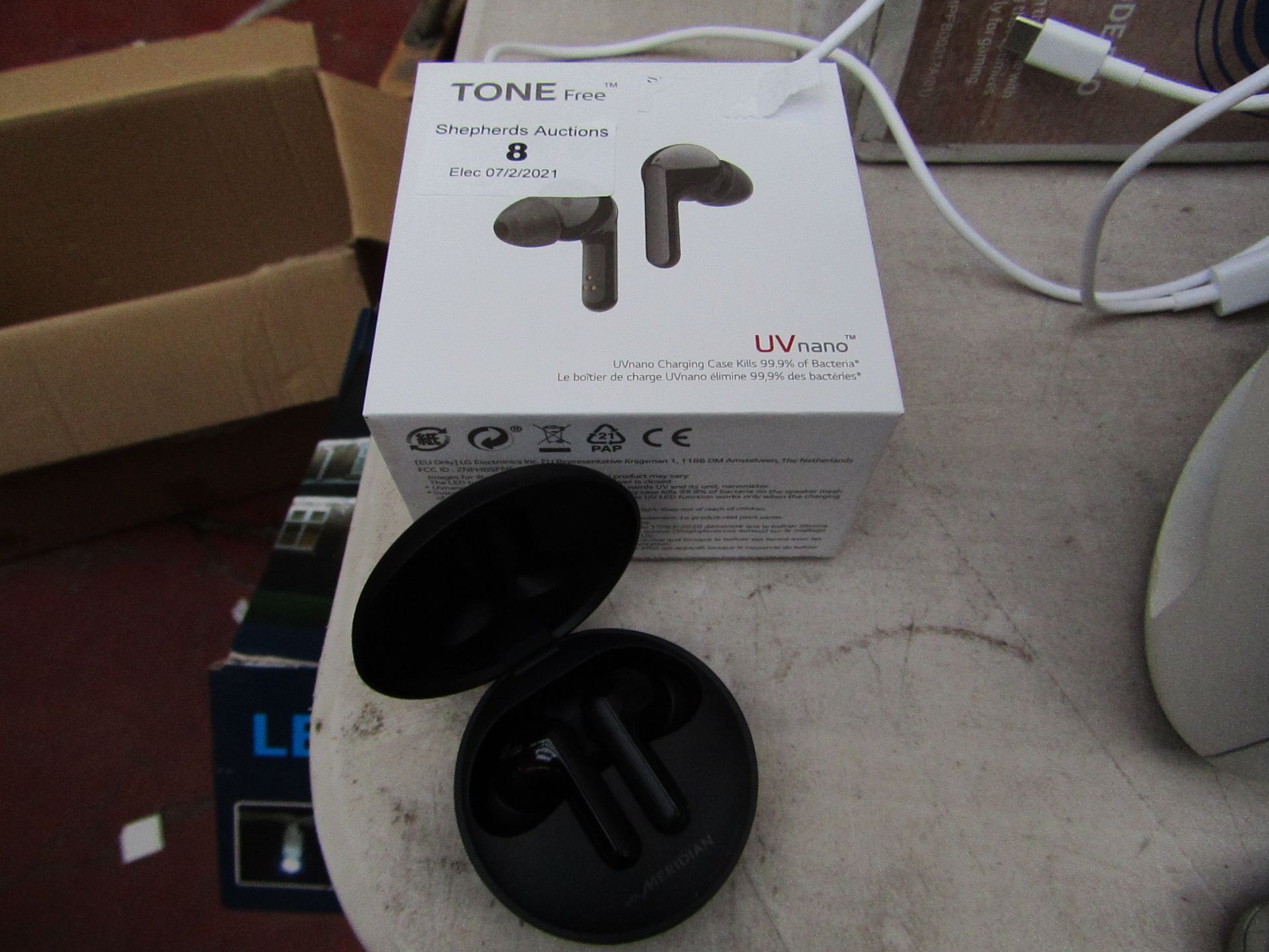 LG Tone Free wireless earphones tested working, charger unchecked and boxed