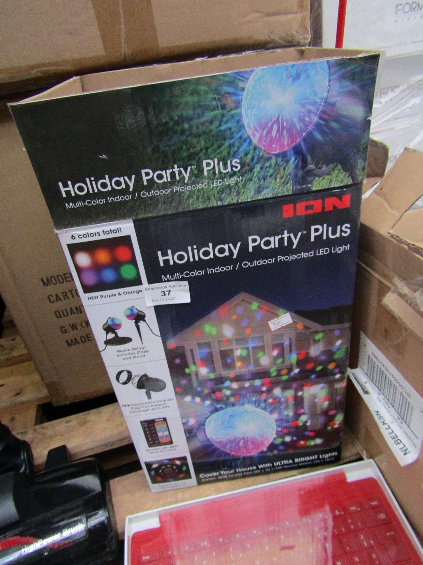 ION holiday party plus indoor/ outdoor projected LED light, no power and boxed.