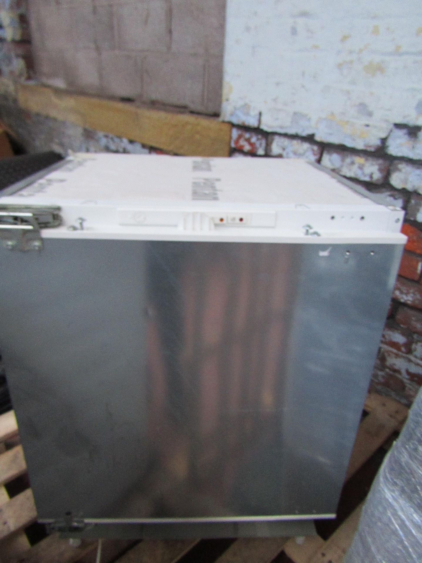 Neff intergrated under-counter .freezer, tested working, the plastic drawer front is cracked and