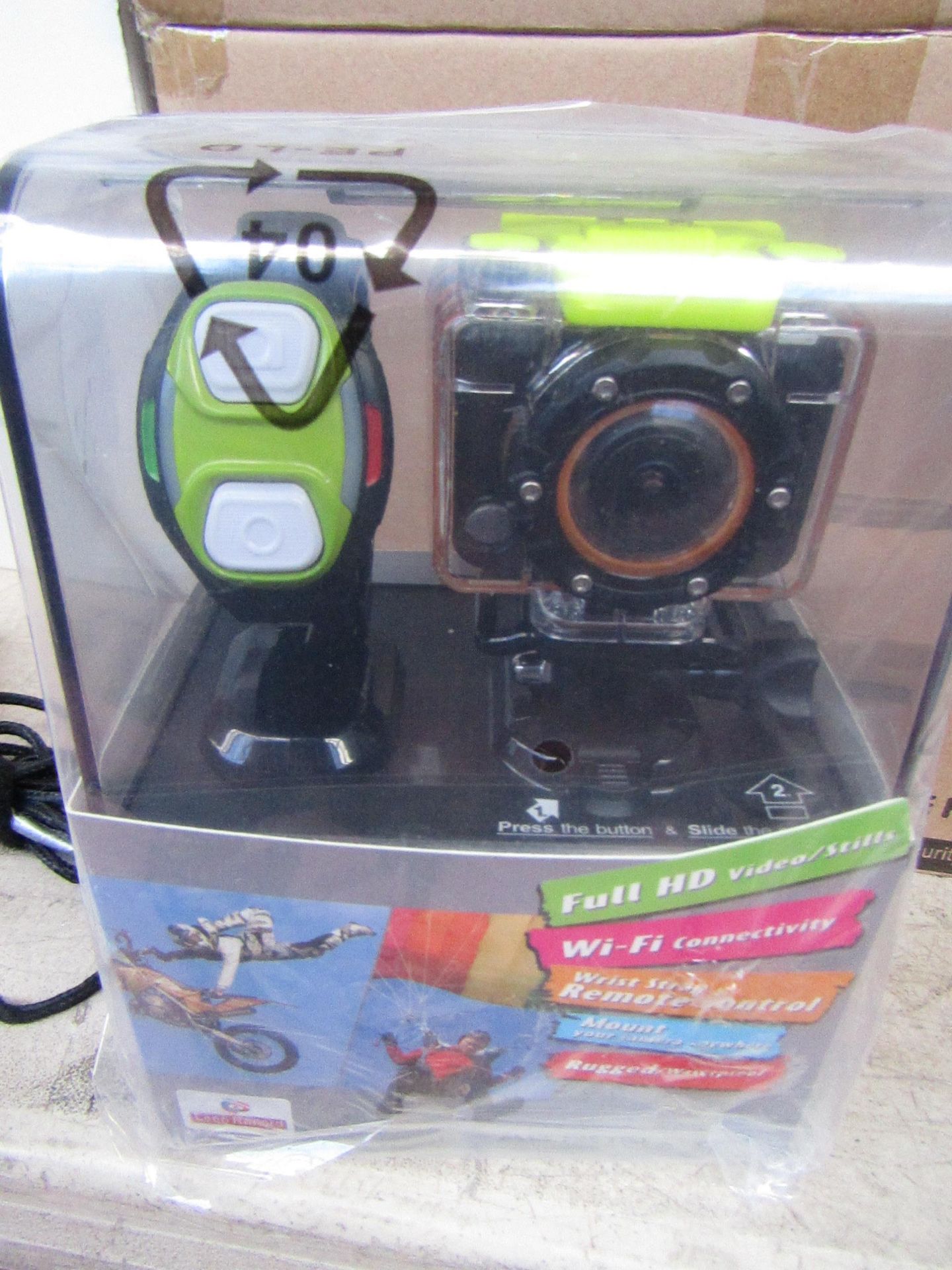 Full HD sports WiFi action camera with accessories and bracelet, tested working and boxed.