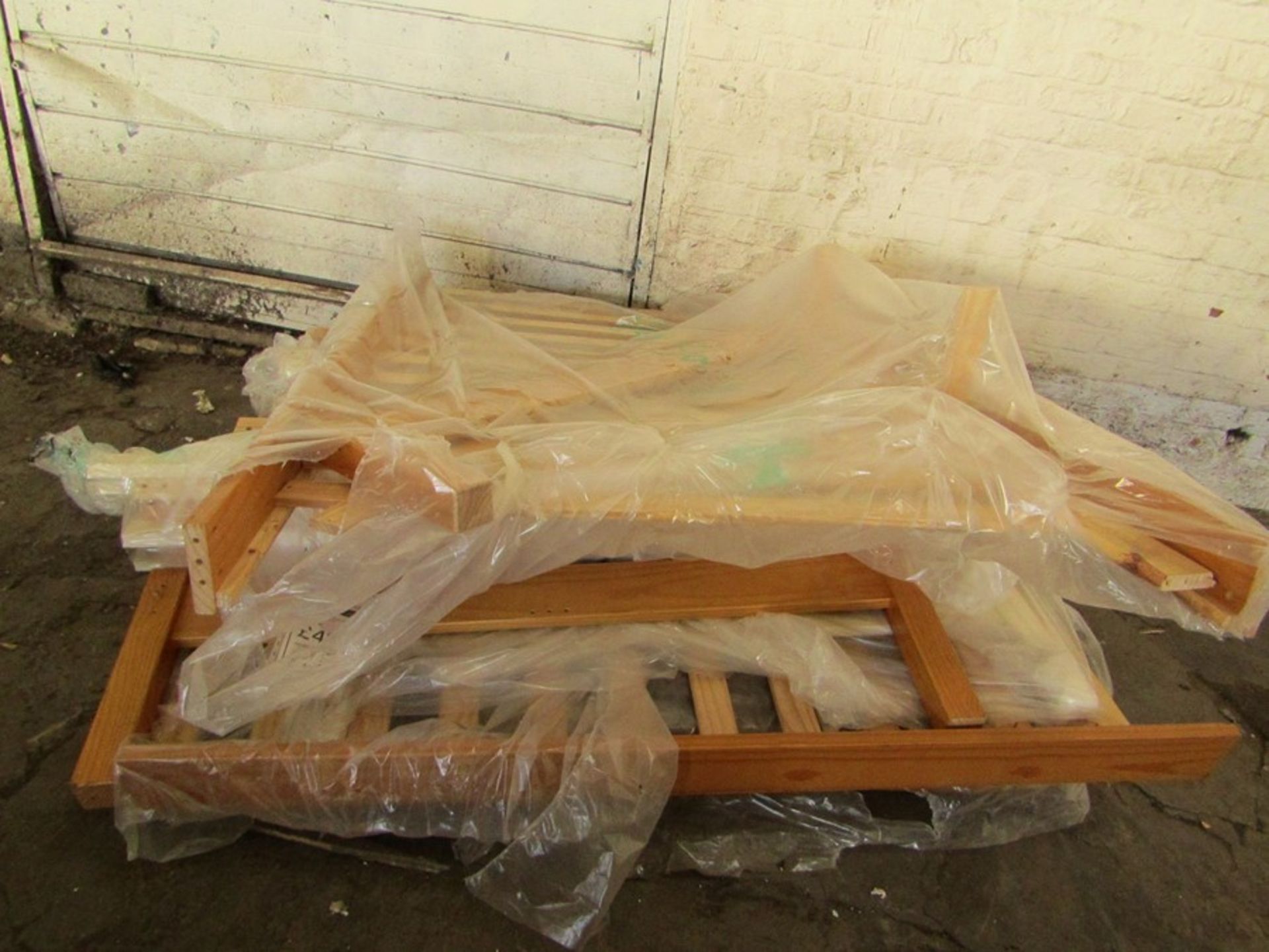 Pallet of parts to 2 Double wooden bed frames, completely unchecked