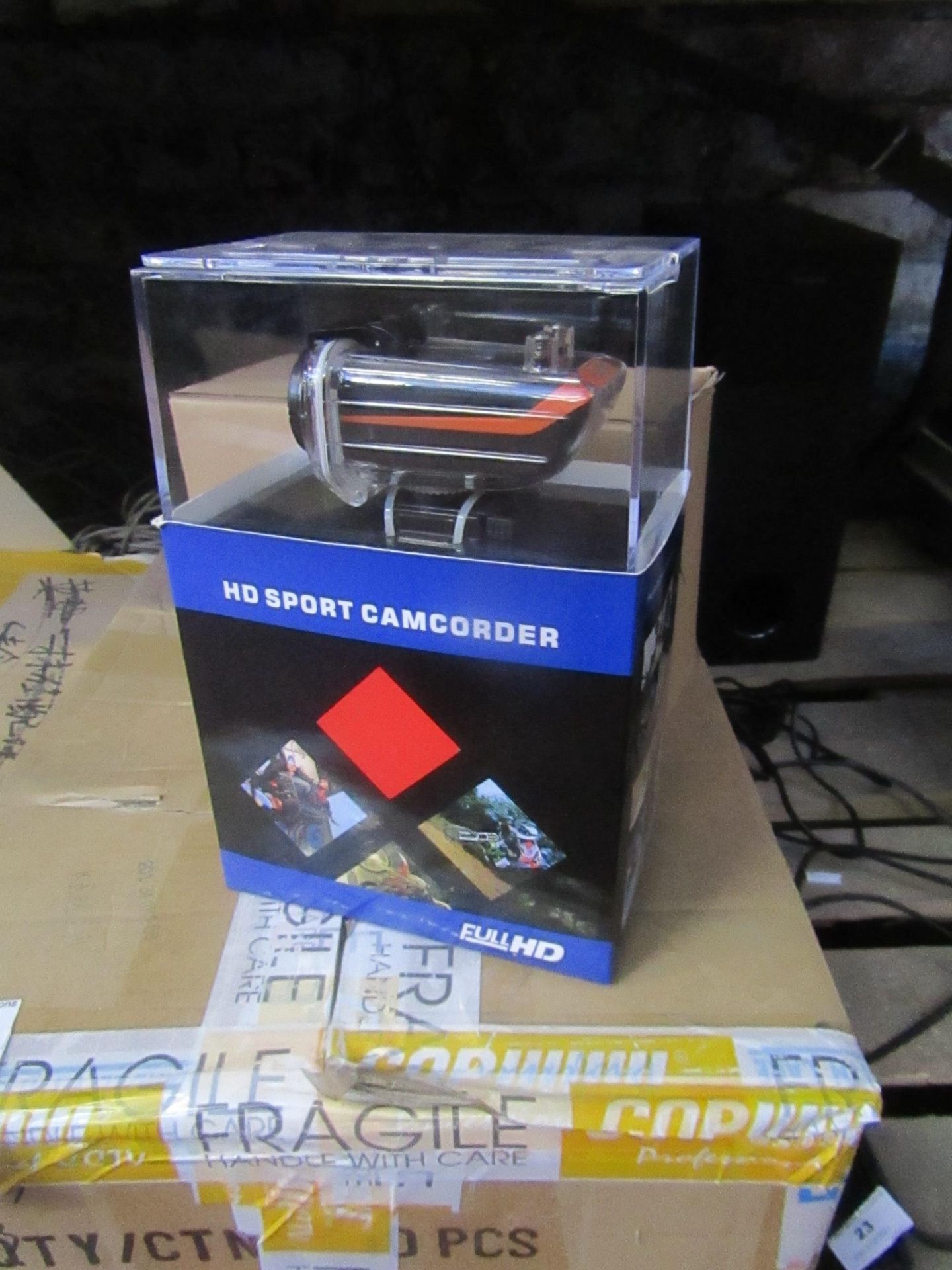 HD sport action camcorder with accessories, tested working and boxed.