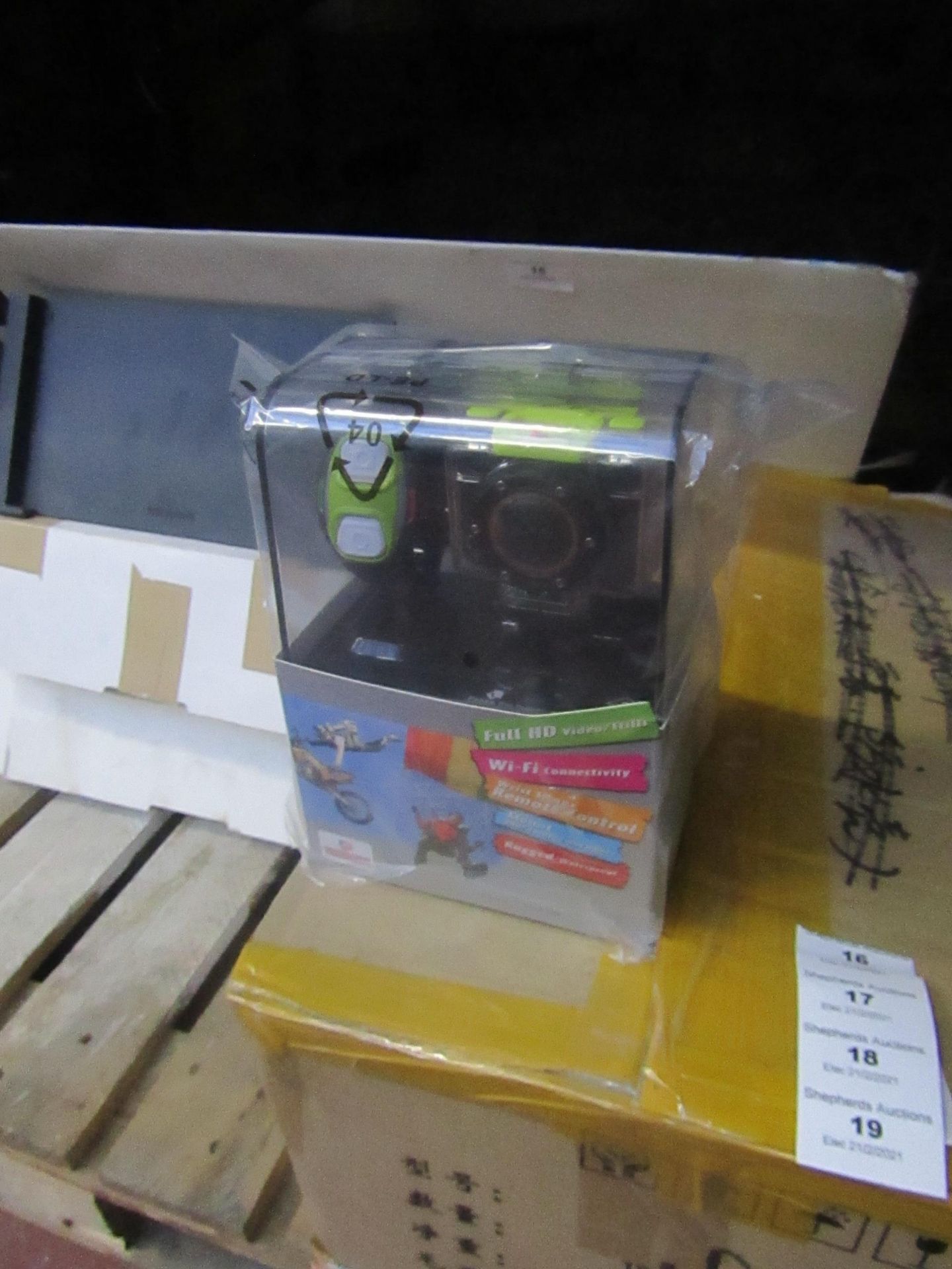 Full HD sports WiFi action camera with accessories and bracelet, tested working and boxed.